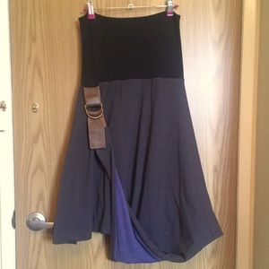 Knee length skirt with twisted front leather tie up.